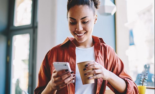 Woman smiling at phone