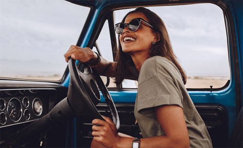 Woman smiling while driving